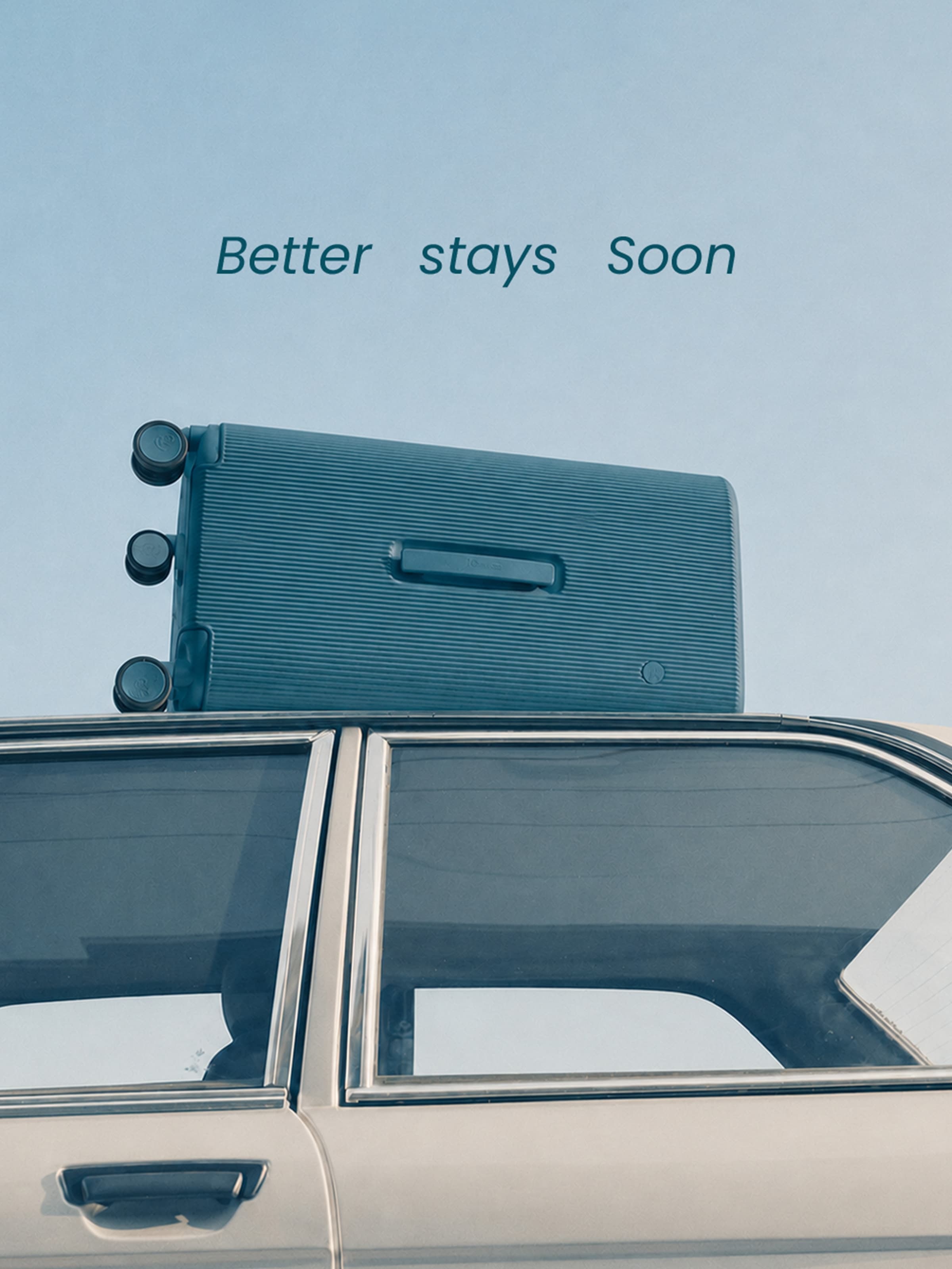 Better stays soon — a teal suitcase strapped to a car roof