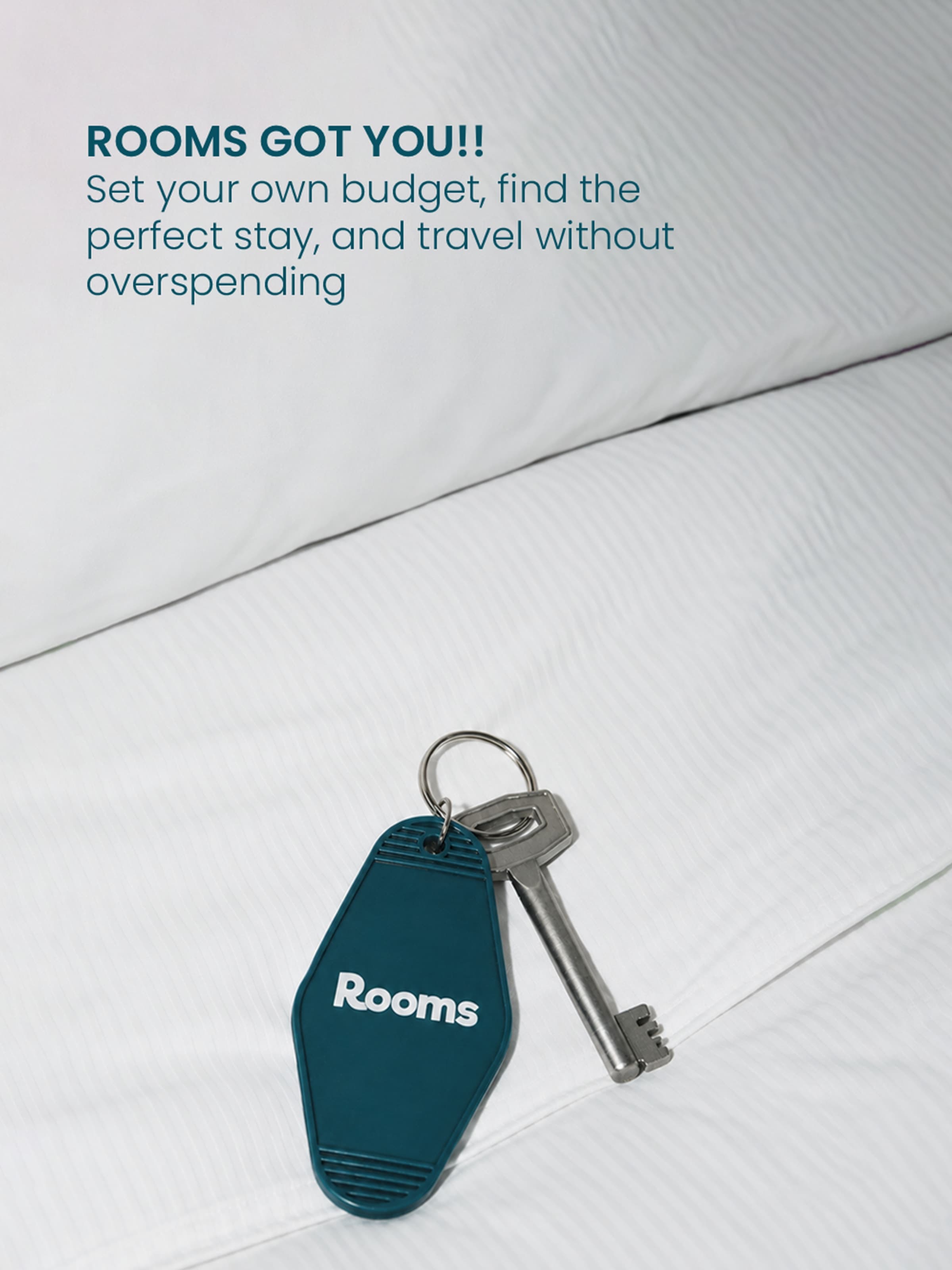 Rooms got you — a hotel key on white sheets